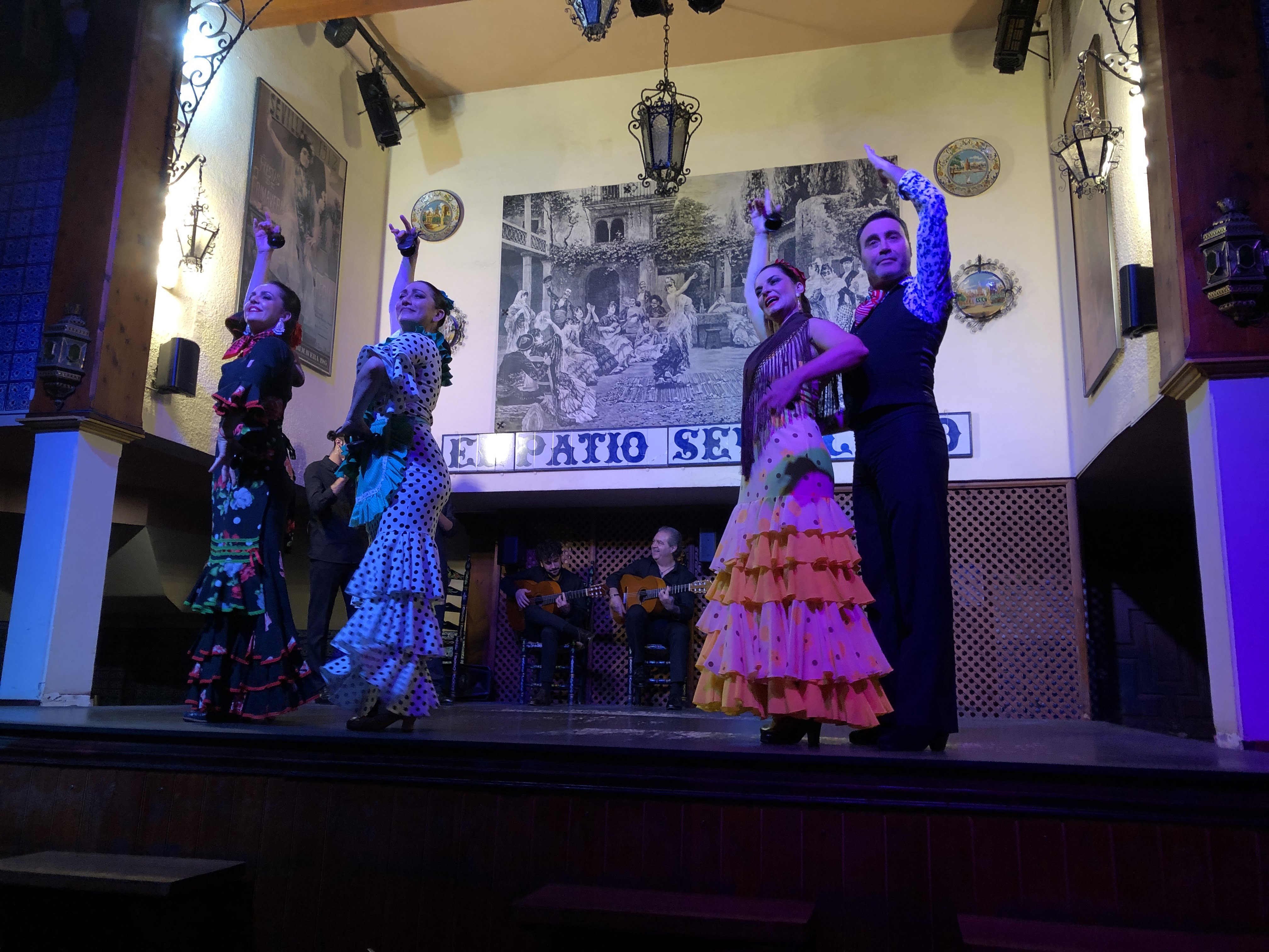 A group of people dancing on a stage

AI-generated content may be incorrect.